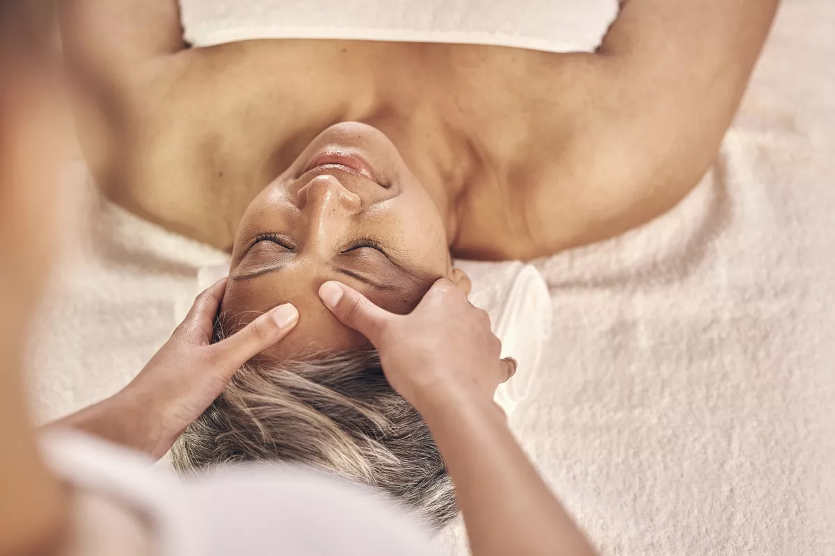 Head, massage and zen with old woman in spa for vacation, luxury and beauty salon. Peace, wellness and holiday with senior person and hands in hotel villa for retirement, oil treatment and body care - © LuneVA/peopleimages.com - stock.adobe.com